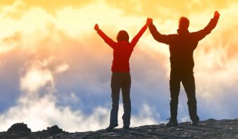 Happy winners reaching life goal - success people at summit. Bus