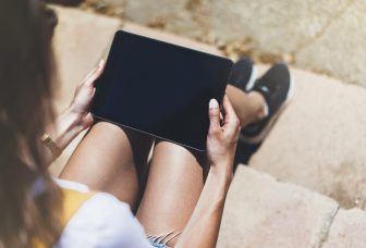 ROF Ipad on Knee Depositphotos_146078359_original - Copy Smaller